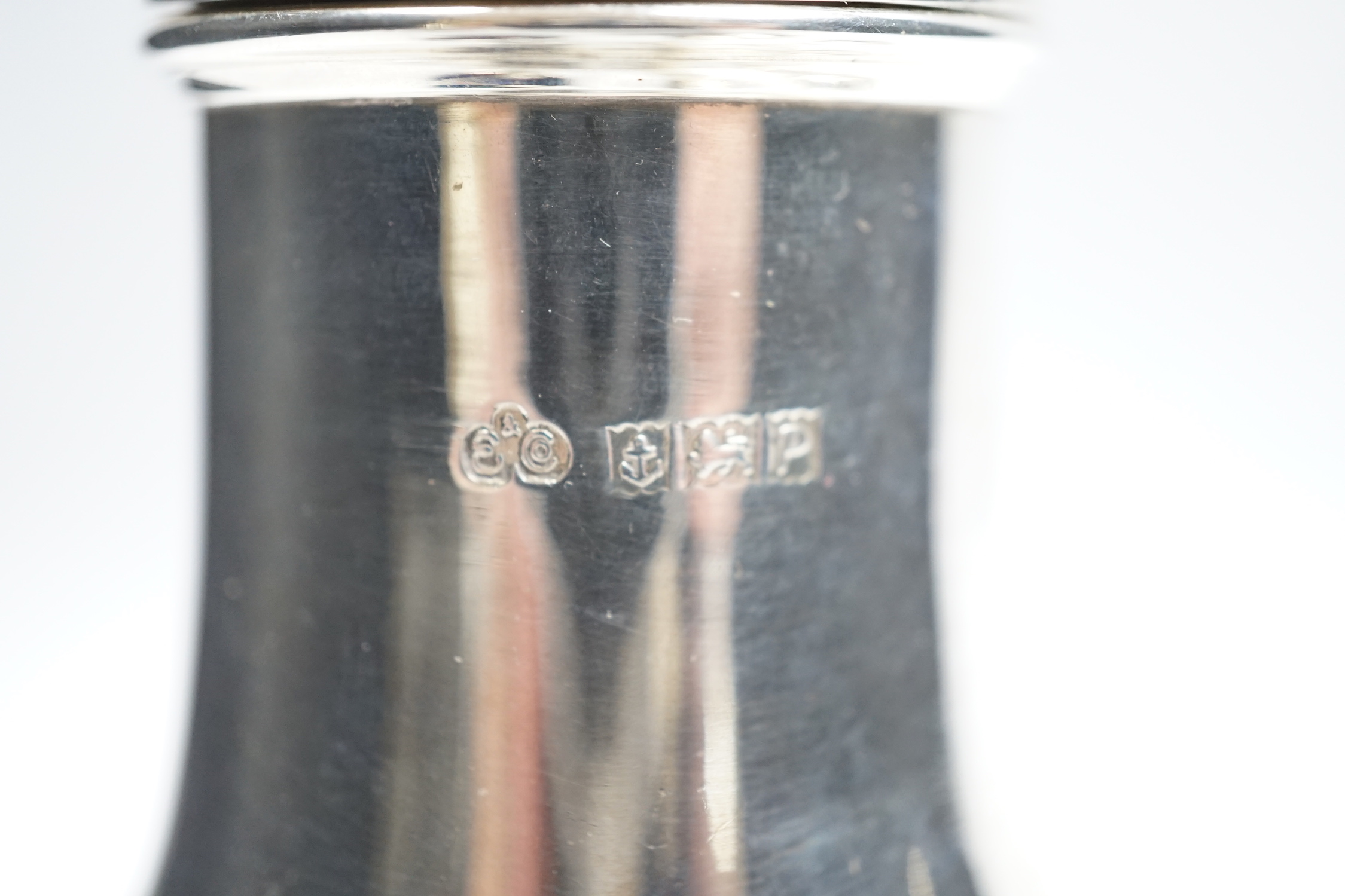 A modern silver baluster sugar caster by Elkington & Co and four assorted silver condiments.